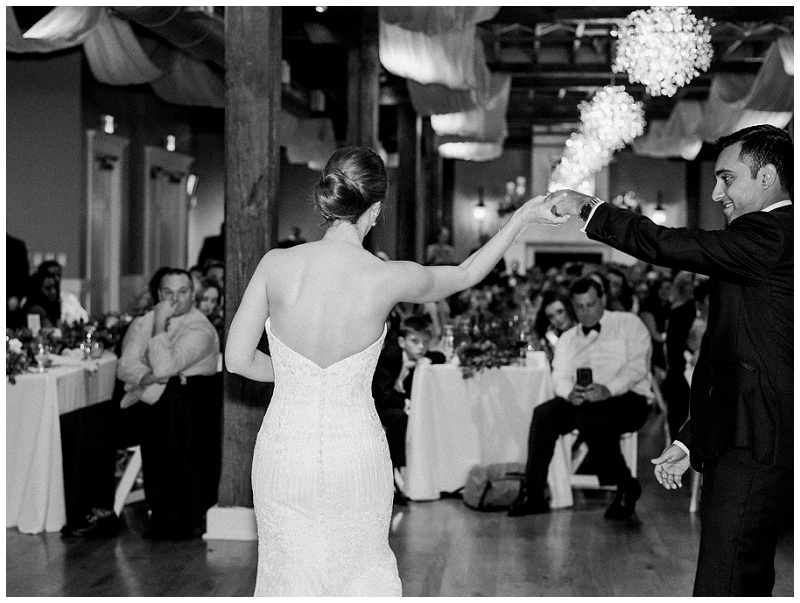 bride and groom dancing at night 