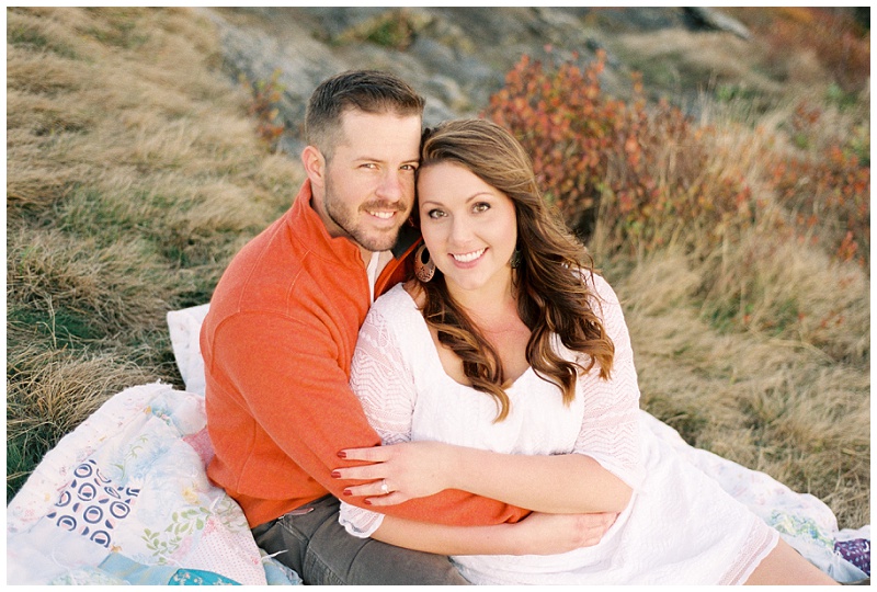 couple at Carvers Gap scenic overlook sunset