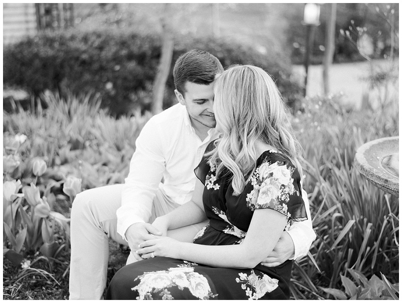 couple embracing under cherry blossoms Jonesborough
