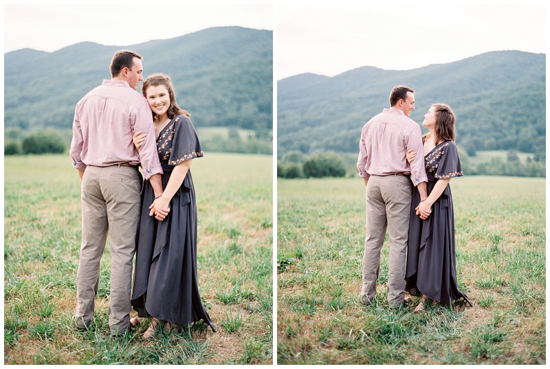 couple laughing in mountain meadow East Tennessee engagement
