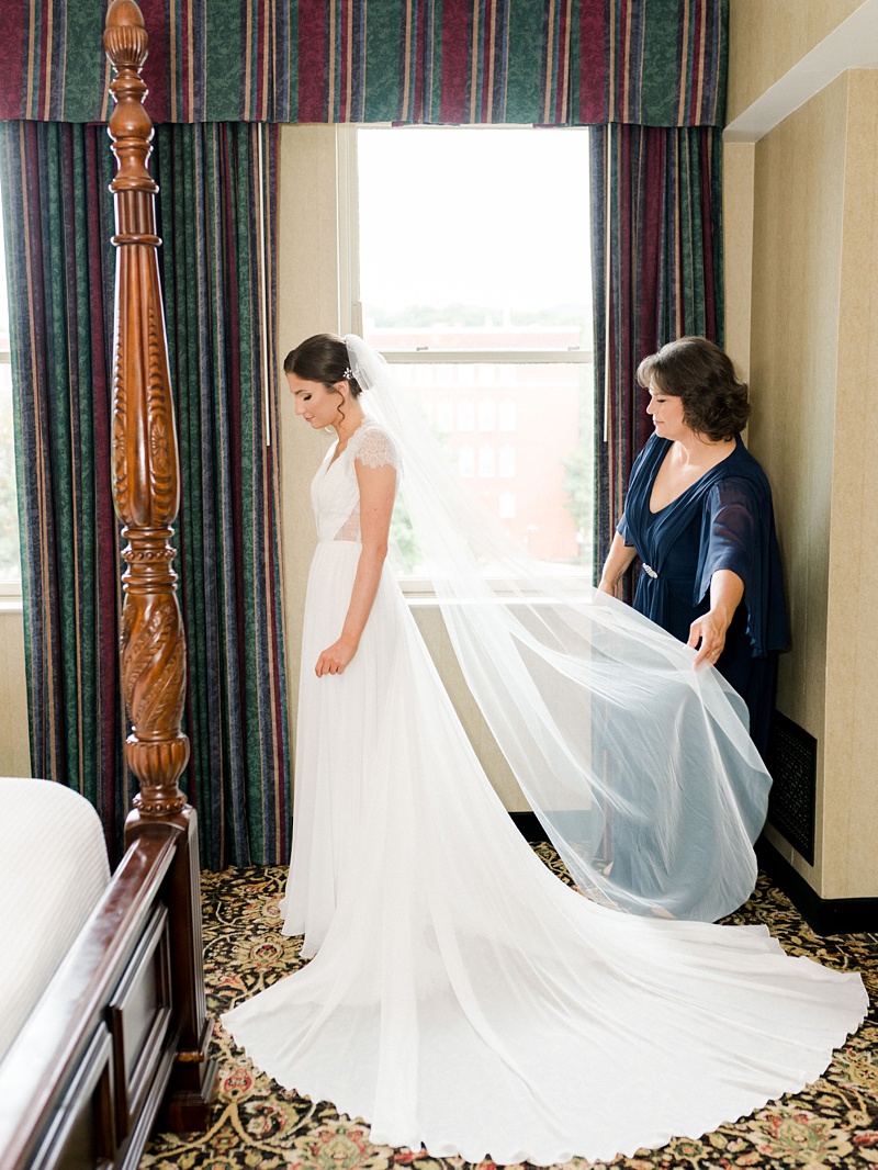 bridal prep mother helping get in wedding dress photos Hidden Meadows TN
