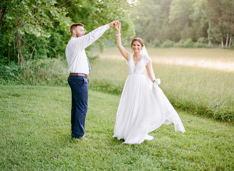 candid bride and groom laughing Hidden Meadows