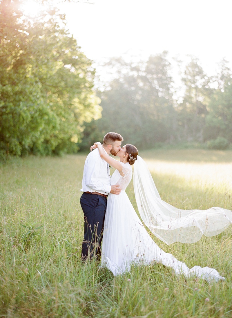 bride and groom walking through farm Afton TN