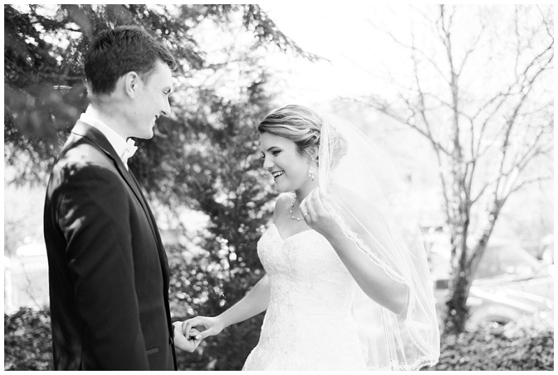 couple embracing near castle-style Homewood venue