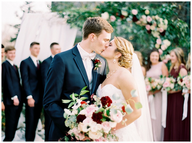 bridal party laughing in sunlight Homewood Asheville NC