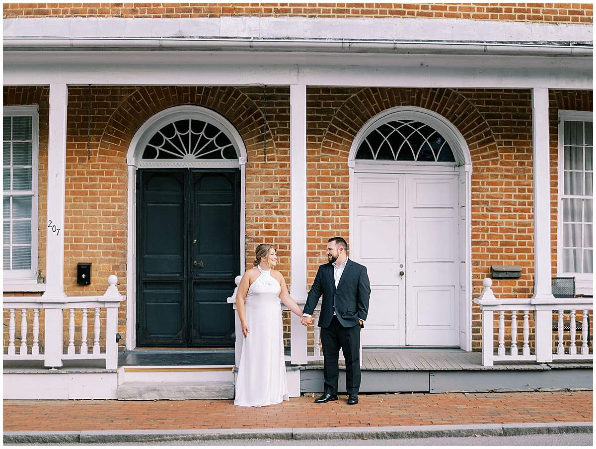 couple laughing downtown Jonesborough engagement photos