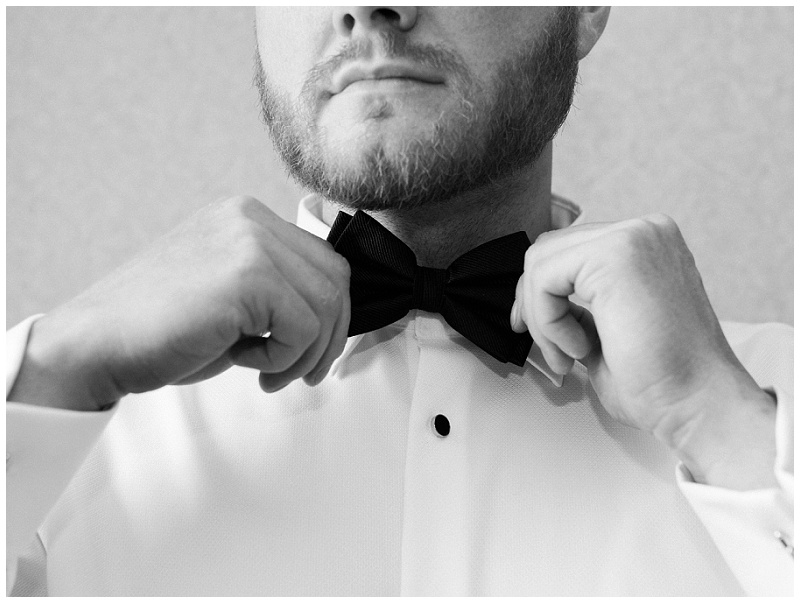 groom tying tie wedding prep TN