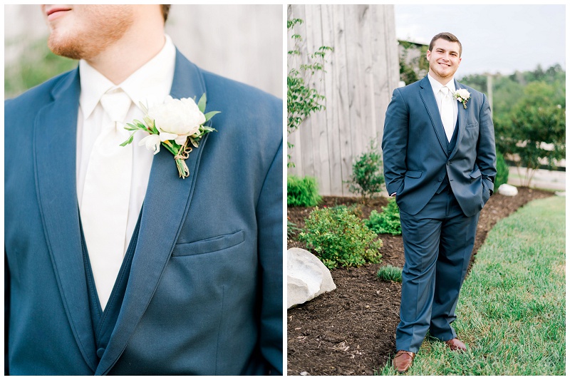 groom wearing blue suit at a Tennessee barn wedding