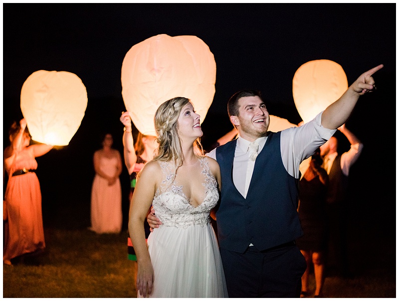 groom and bride enjoying a glowing lantern send off East Tennessee wedding