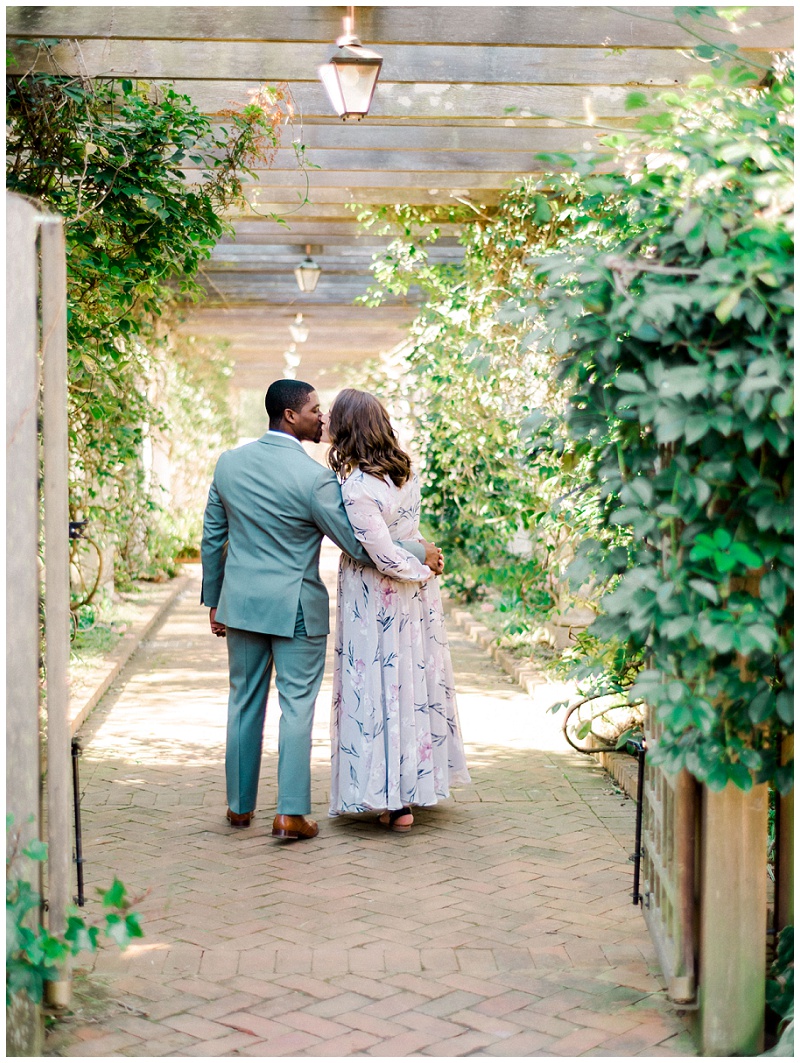 charlotte nc engagement session couple laughing in garden