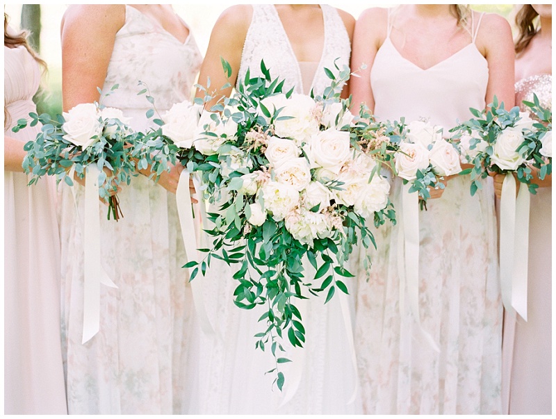 bridesmaids holding blush bouquets