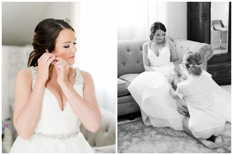 bridesmaids helping bride with dress