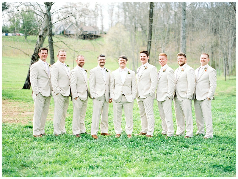 bridal party posed barn backdrop