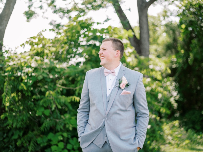 Groom standing outside barn at Greeneville TN venue
