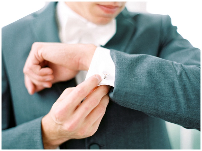 Groom adjusting jacket at Bleak House