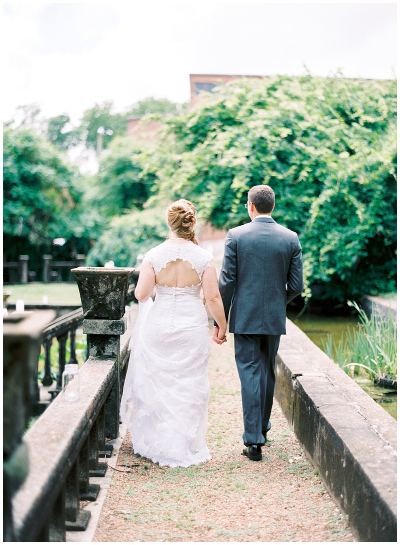 Bride and groom under trees at Bleak House