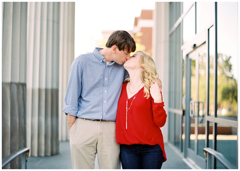 Couple walking on Ole Miss campus during engagement session in Oxford MS Couple walking on Ole Miss campus during engagement session in Oxford MS