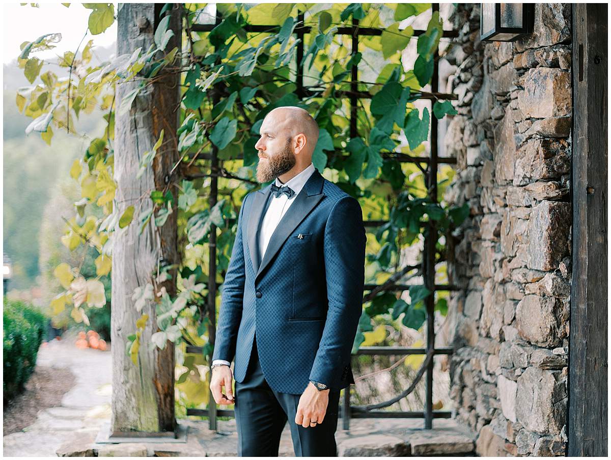 Groom standing in North Carolina vineyard wedding venue