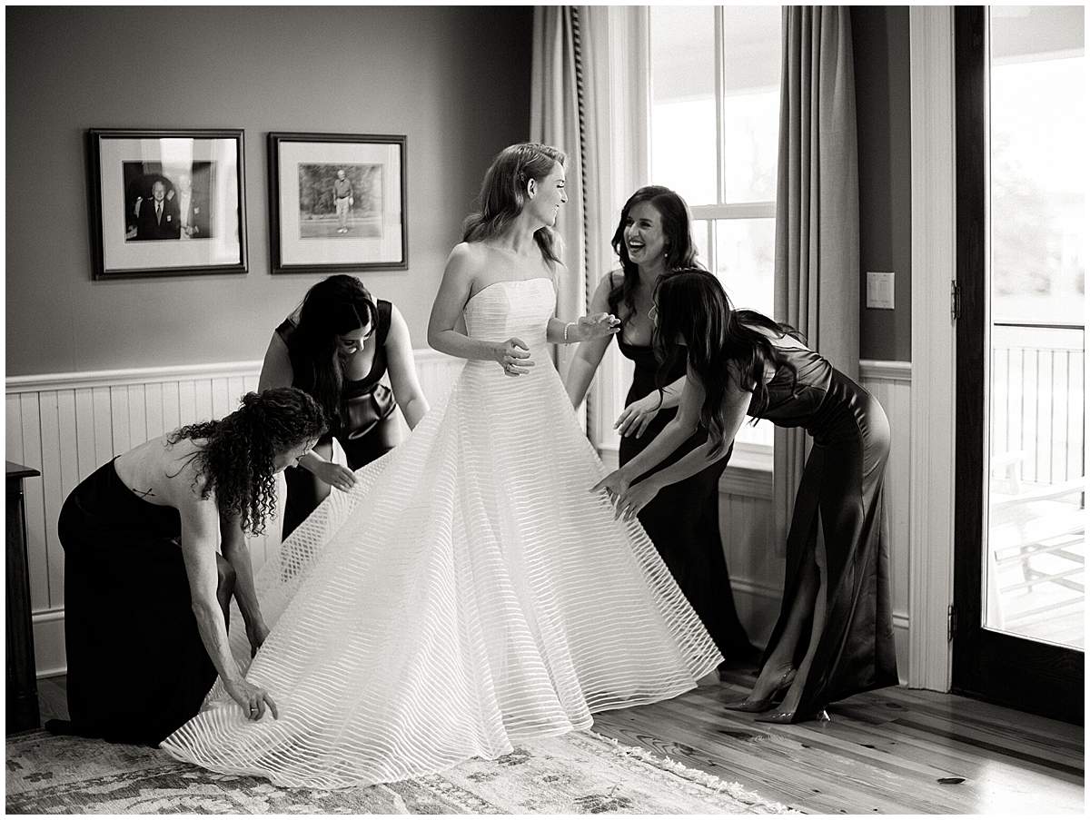 Bride putting on dress for The Olde Farm wedding