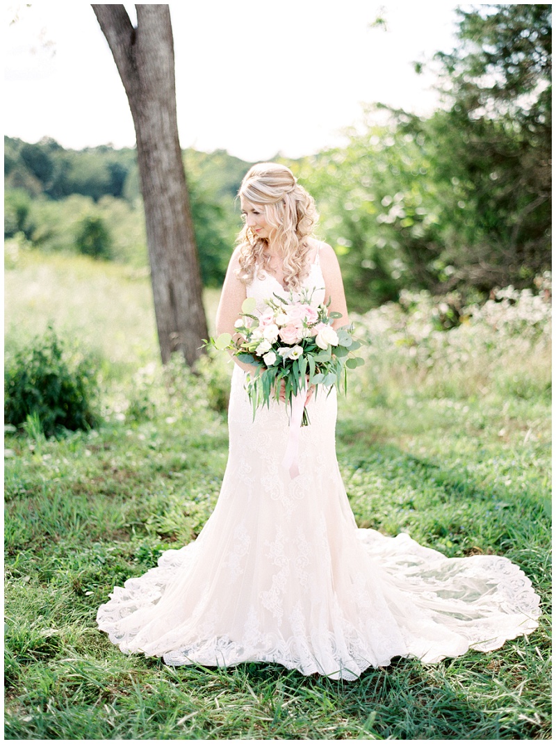 Bride looking over shoulder at The Homeplace at Johnston Farm wedding