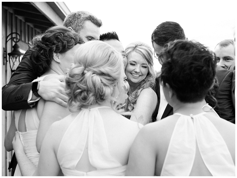 couple having joyful moments with bridal party at The Homeplace at Johnston Farm wedding