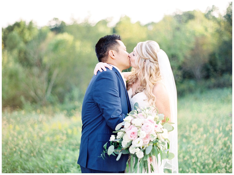 Bride and groom embracing at The Homeplace at Johnston Farm wedding