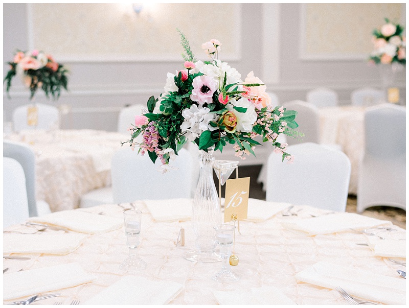 Reception tables with black white and pink decor