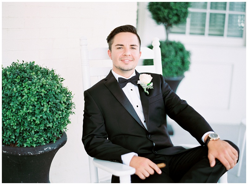 Groom adjusting suit at The Inn at Wise wedding venue