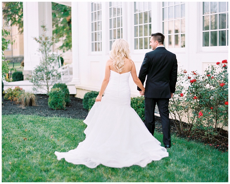 Bride and groom holding hands at The Inn at Wise wedding