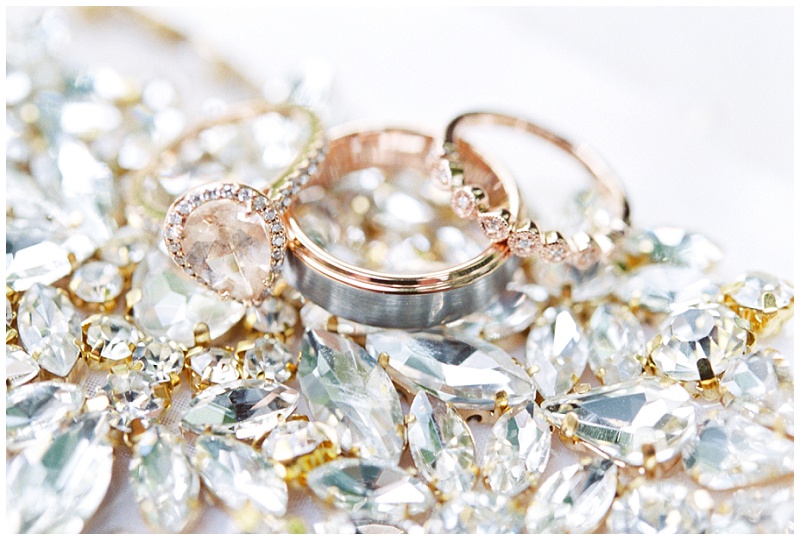 The Millstone wedding venue wedding rings styled with greenery