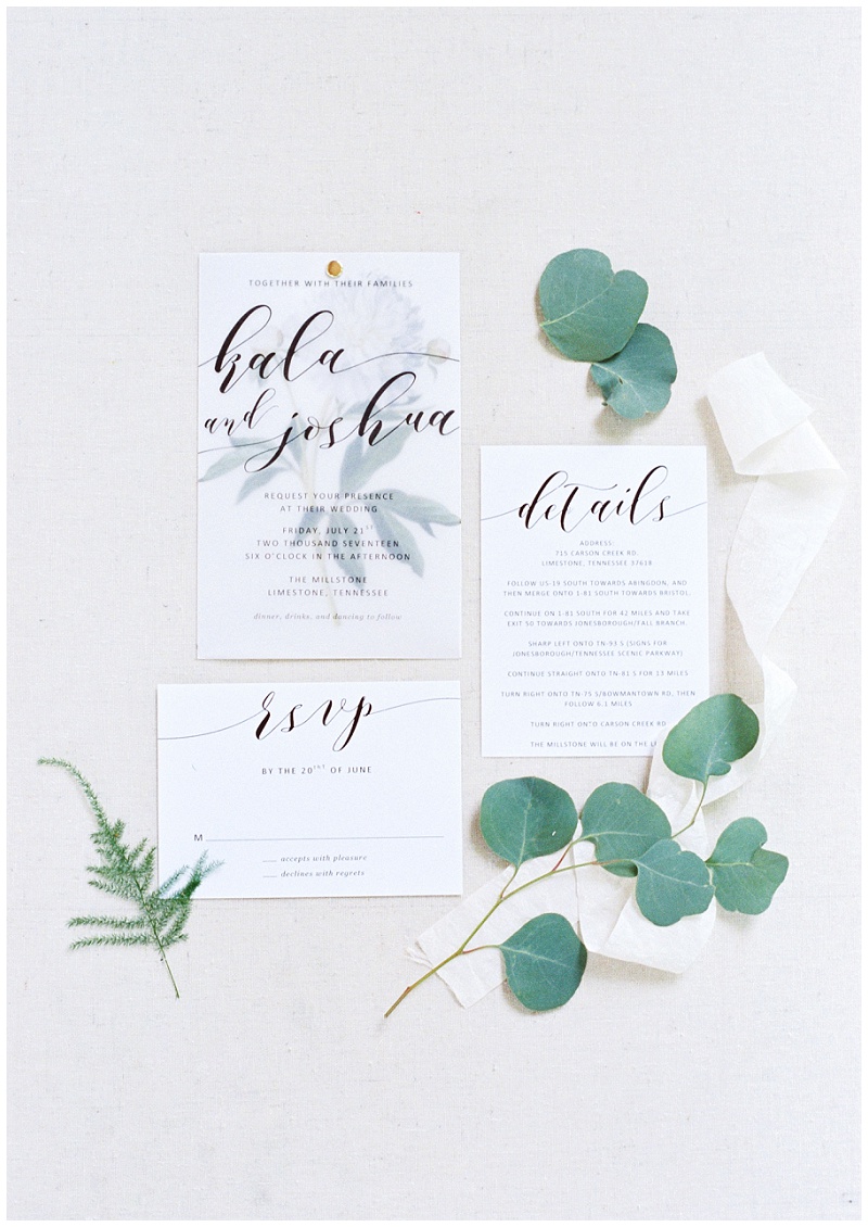 The Millstone wedding venue rustic wedding invitation flat lay