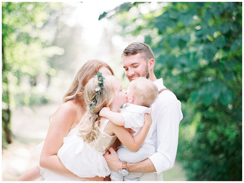 Bride and groom emotional moment with flower girl The Millstone venue
