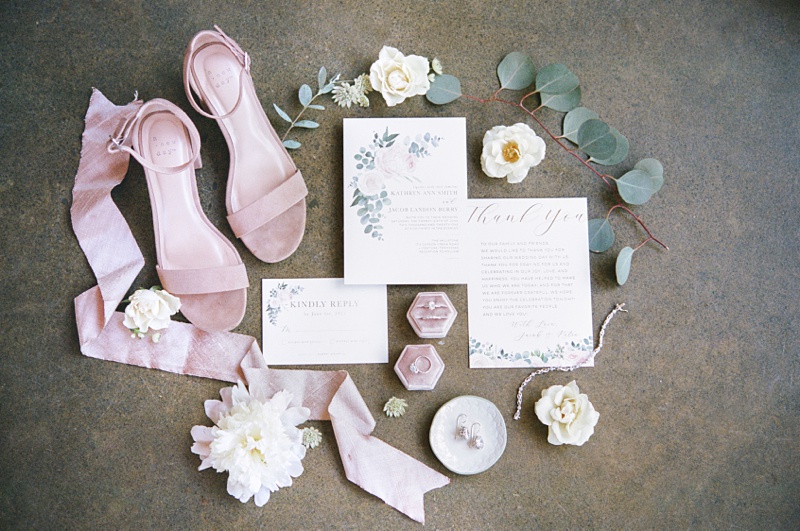 The Millstone wedding venue wedding invitation and stationery flat lay