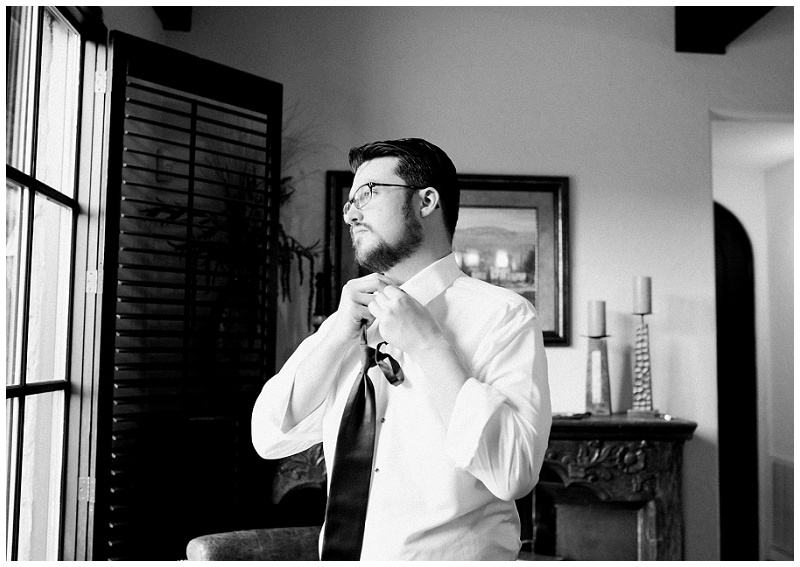 Groom adjusting tie before ceremony in East Tennessee