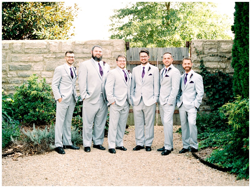 Bridesmaids holding bouquets in summer wedding