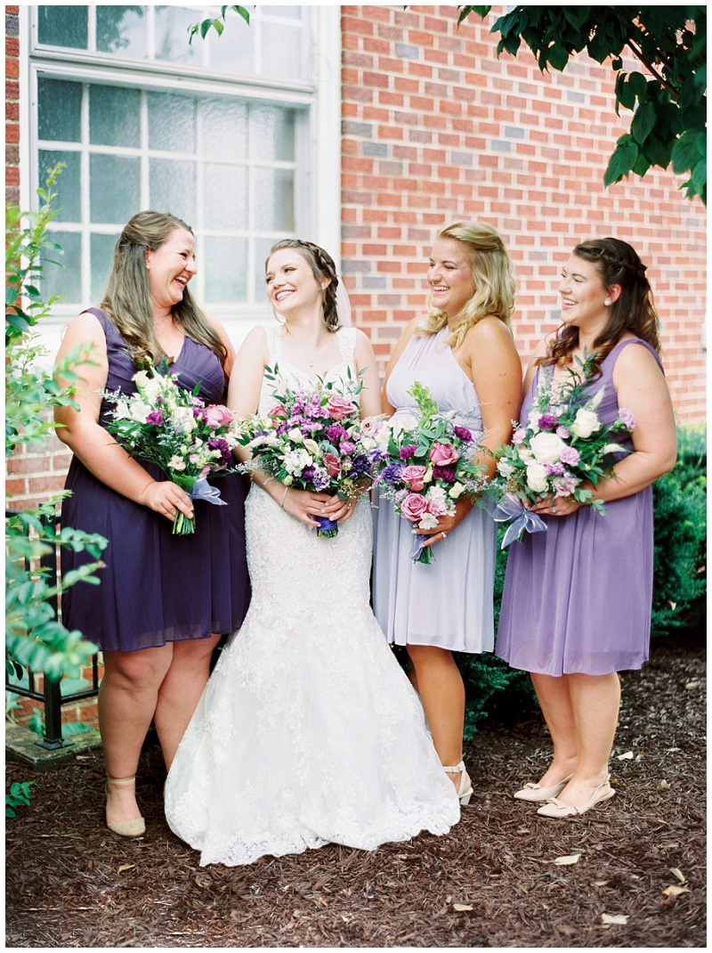 bridal party walking church courtyard