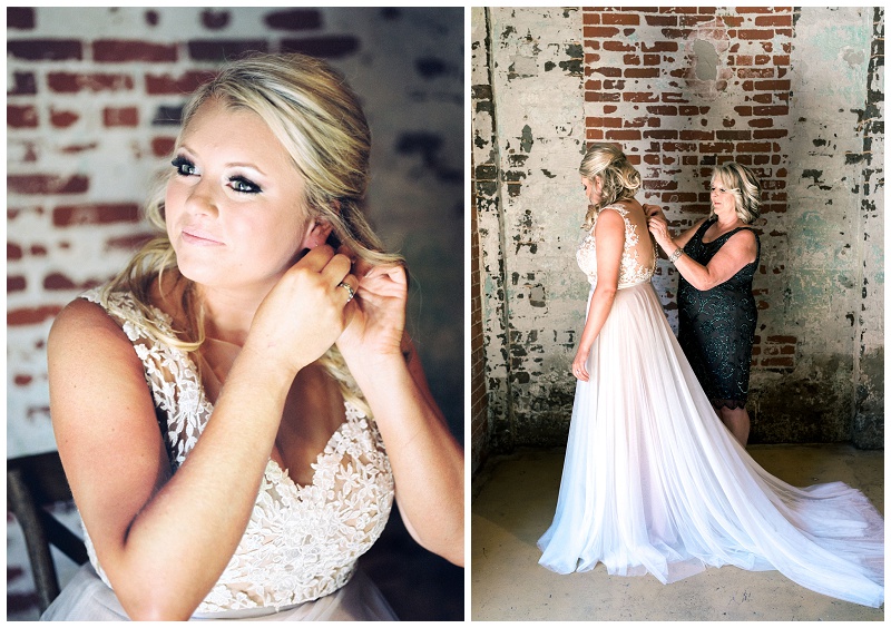 mom helping bride put on wedding dress Old Woolen Mill