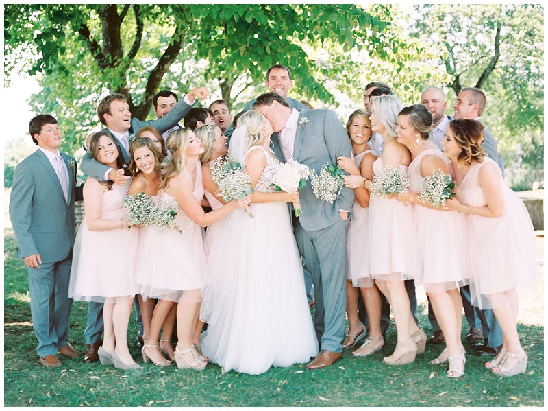 wedding party cheering newlyweds