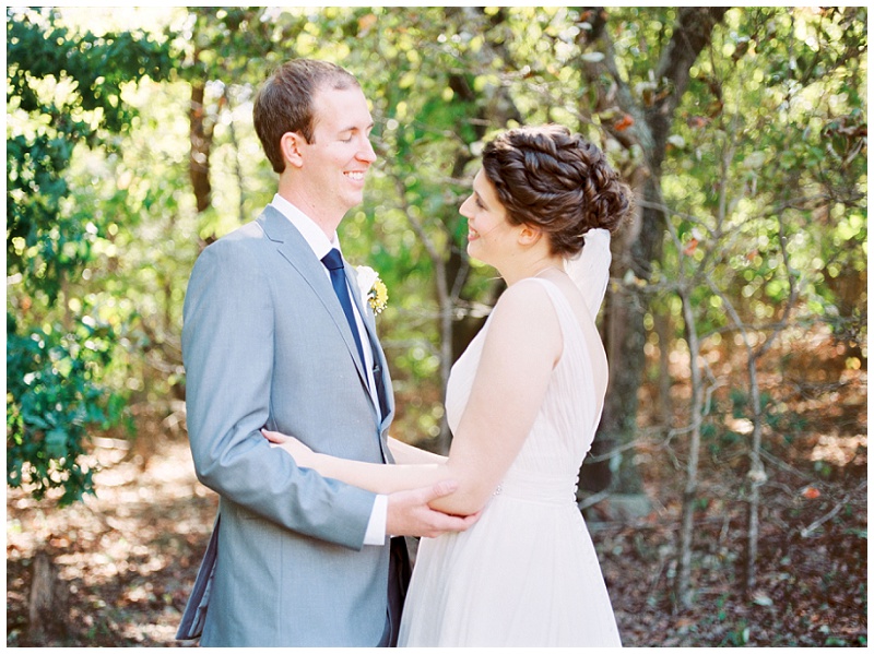 barn wedding couple having first look portraits Tennessee