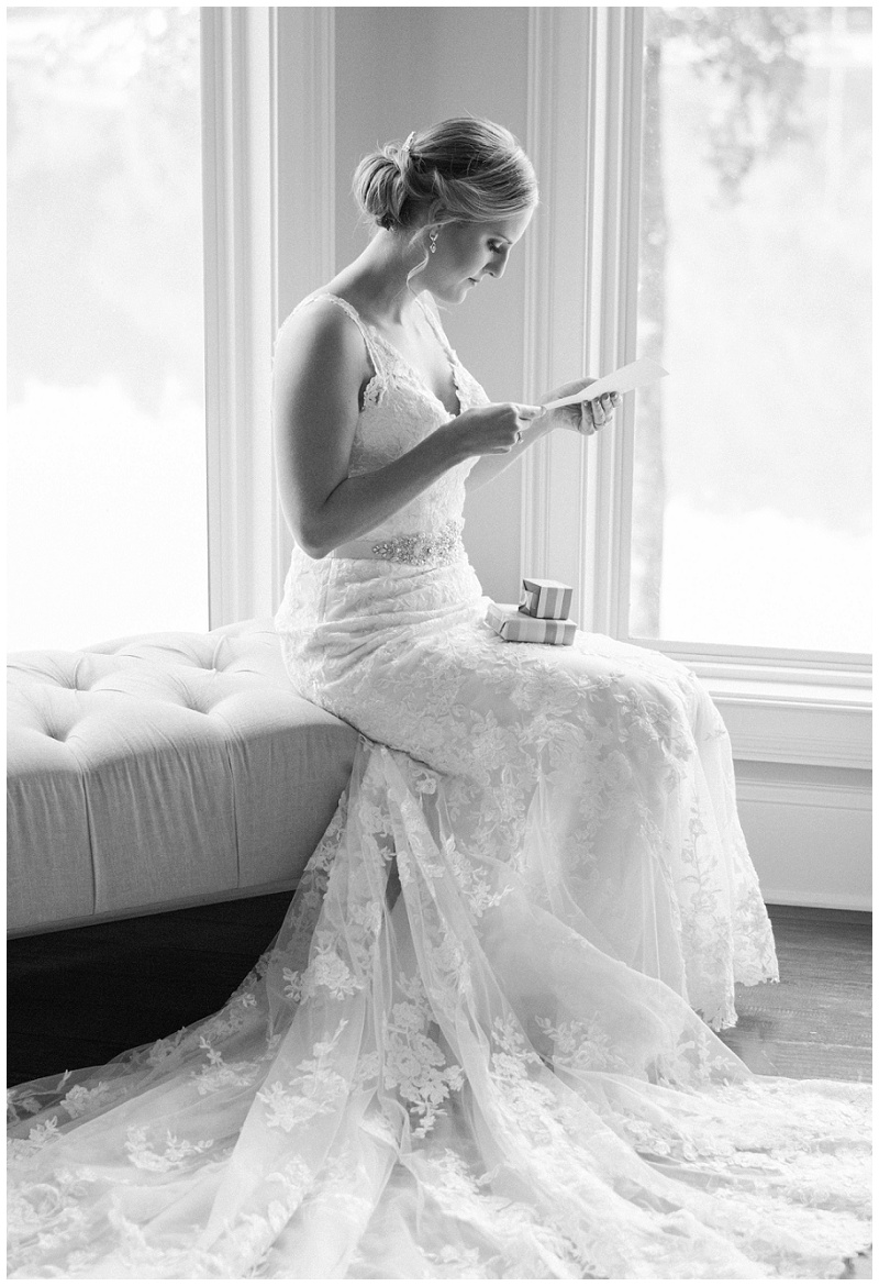 bride reading grooms letter at home wedding