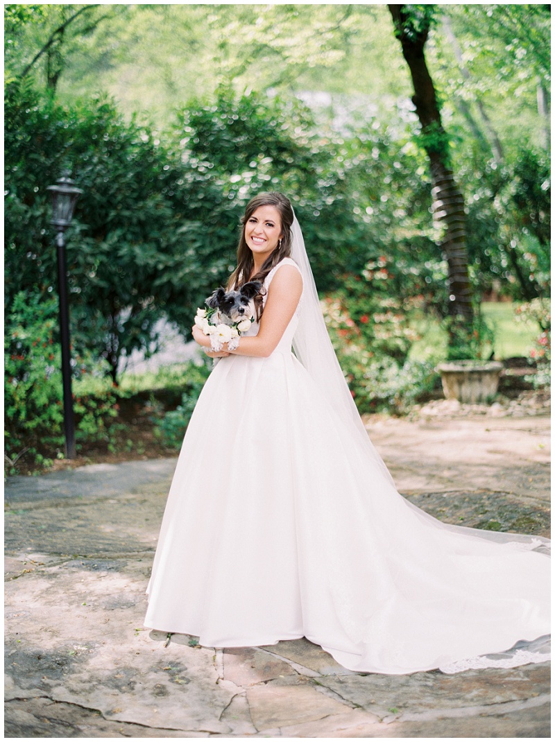 bridal portrait holding dog