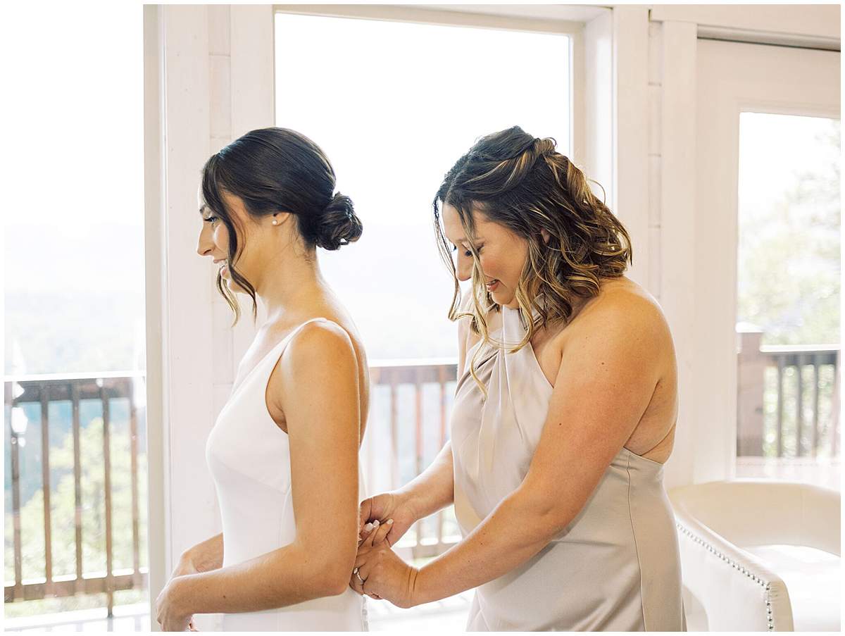 bridesmaids helping bride Magnolia Venue