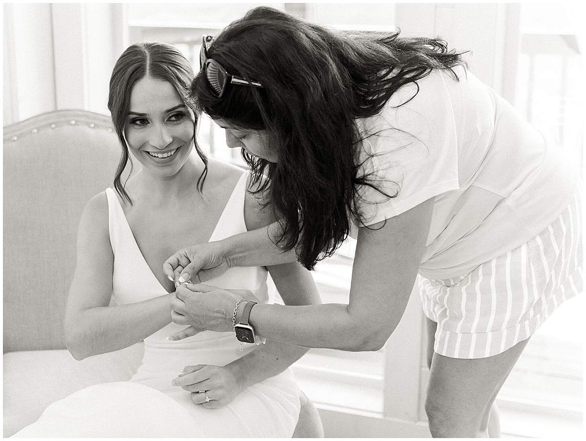 bride putting on dress Magnolia Venue