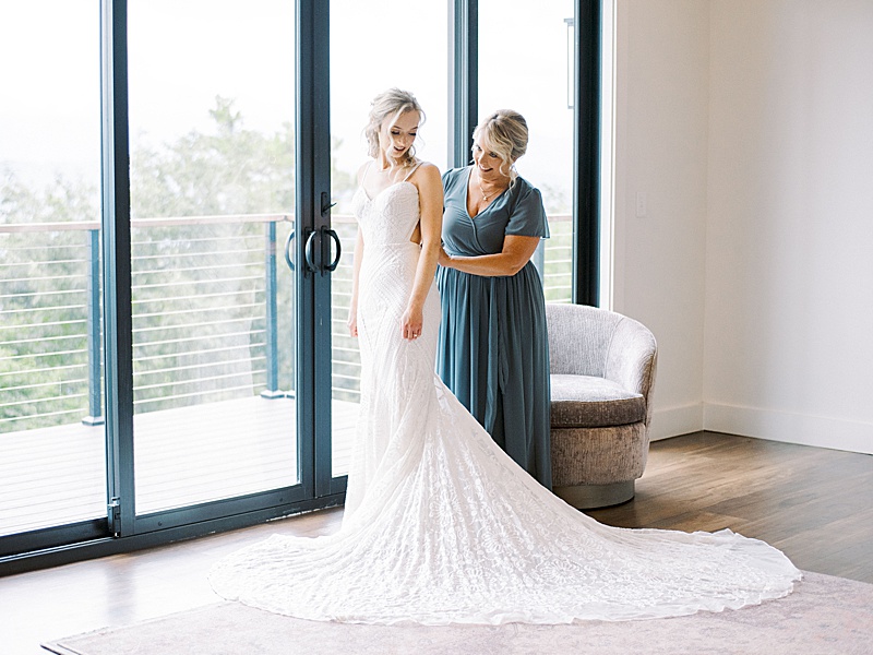 bride putting on dress Trillium Venue bride putting on dress Trillium Venue