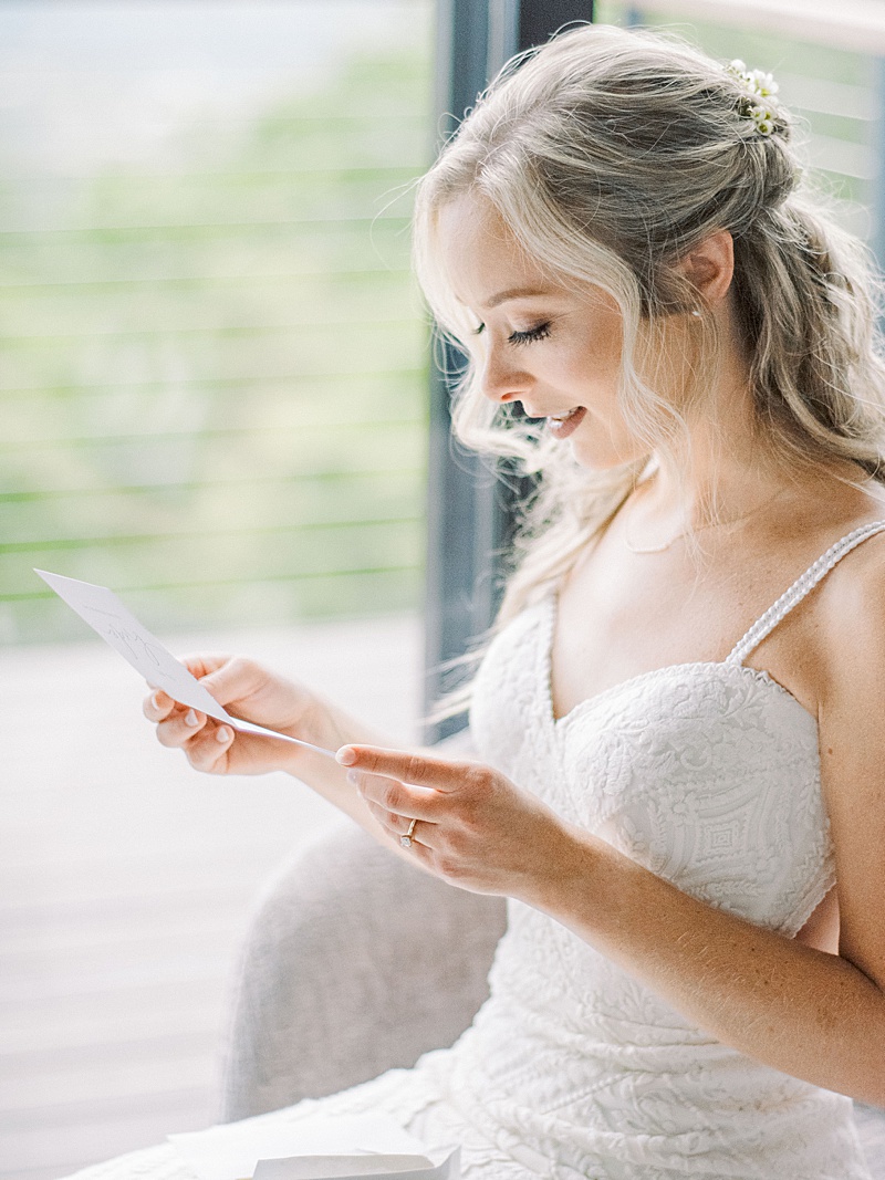 bride reading letter from the groom at her smoky mountain Tennessee wedding bride reading letter from the groom at her smoky mountain Tennessee wedding