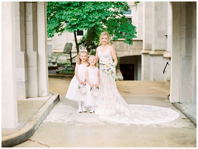 bride candid moments with flower girls