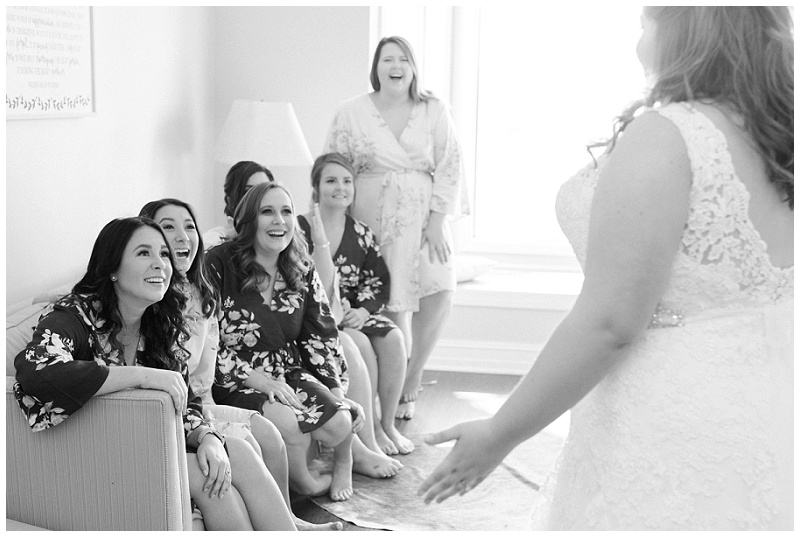 bridesmaids seeing brides dress for the first time