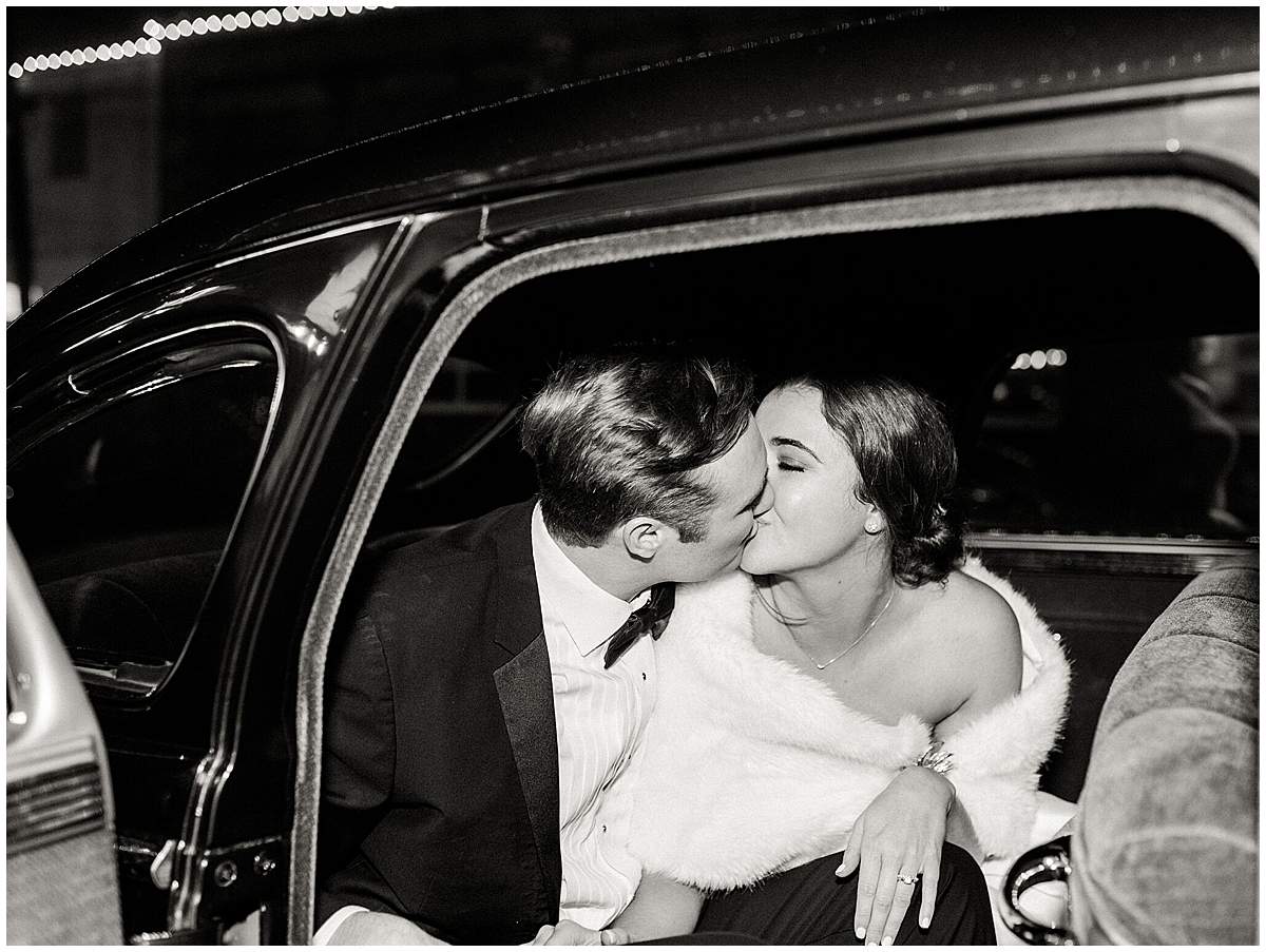 newlyweds exit the lyric oxford reception in get away car