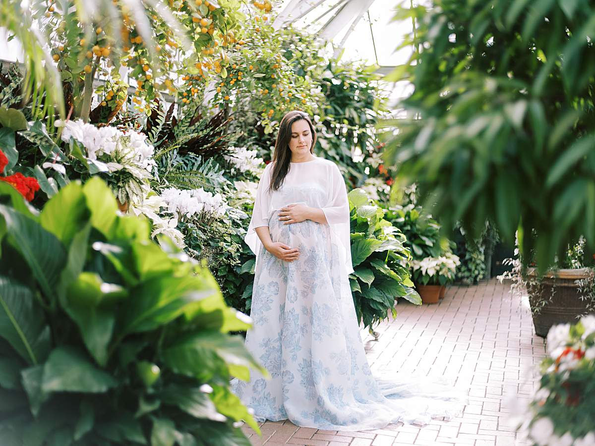Lush greenery and historic architecture at a Biltmore Estate maternity session.