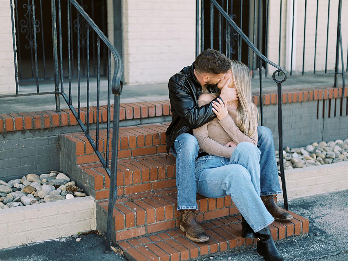 Natural light portrait of a couple kissing downtown greenville in South Carolina. Natural light portrait of a couple kissing downtown greenville in South Carolina.